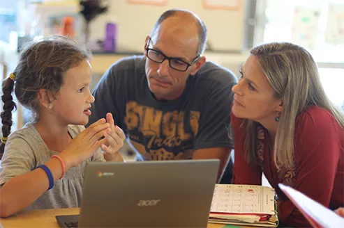 Parents and child learning together at Creators House